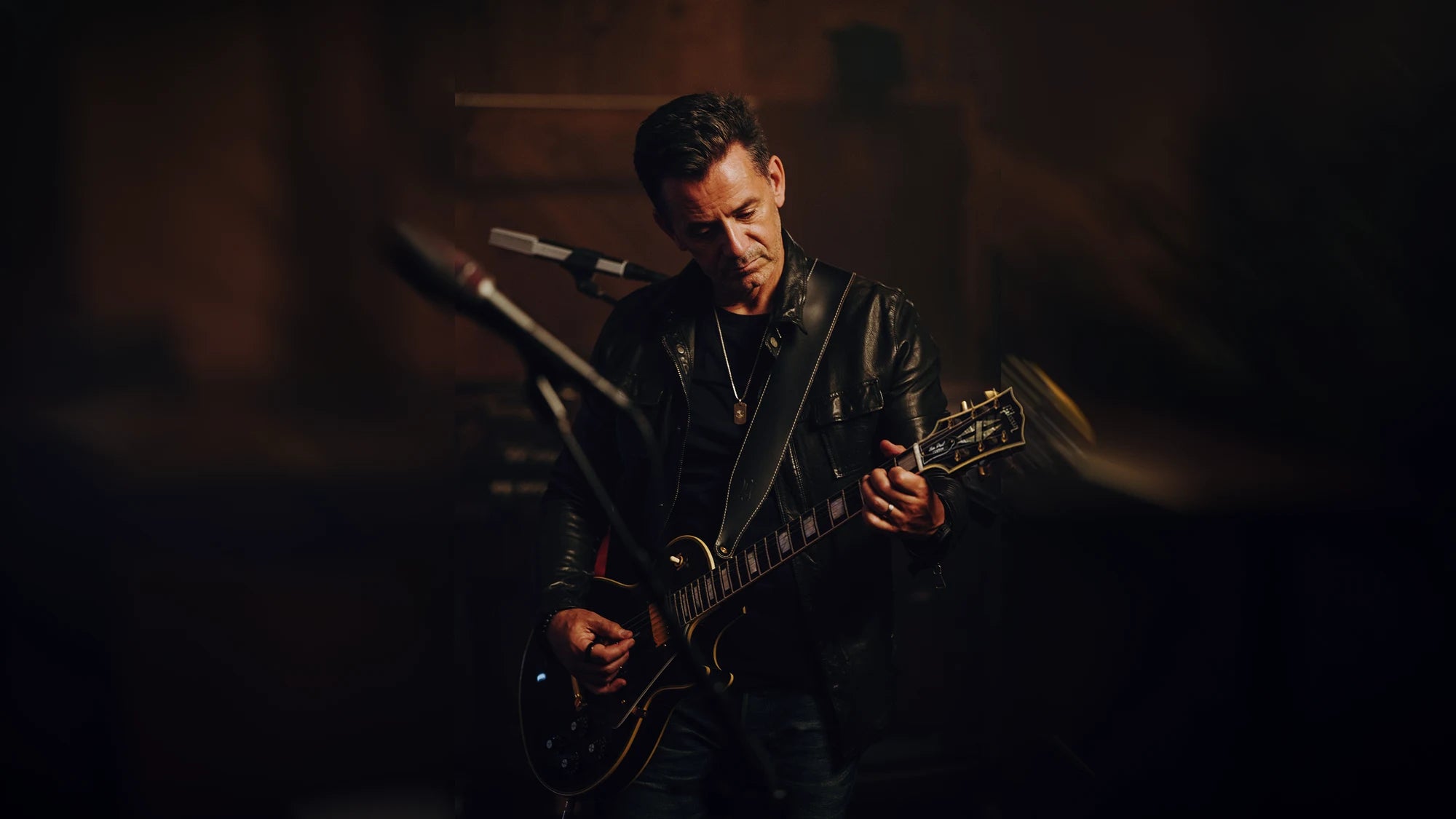 Eric Hirshberg playing electric guitar