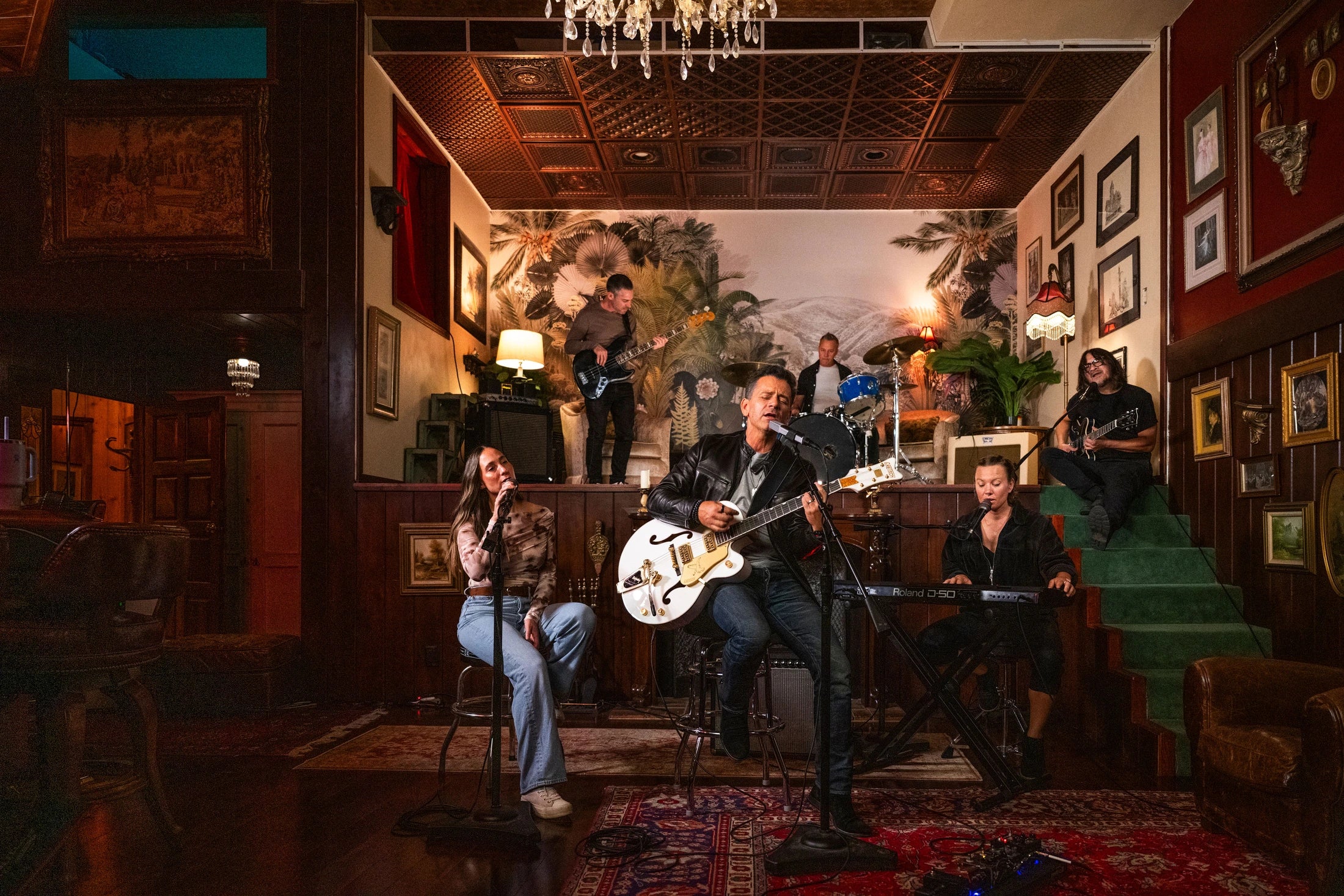 Eric Hirshberg and musicians together in an intimate performance room